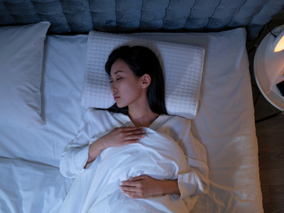 a lady getting deep sleep in bed